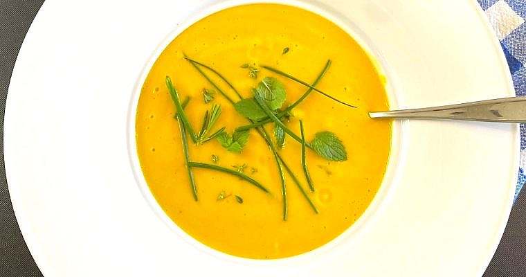 Cream of carrot soup serving