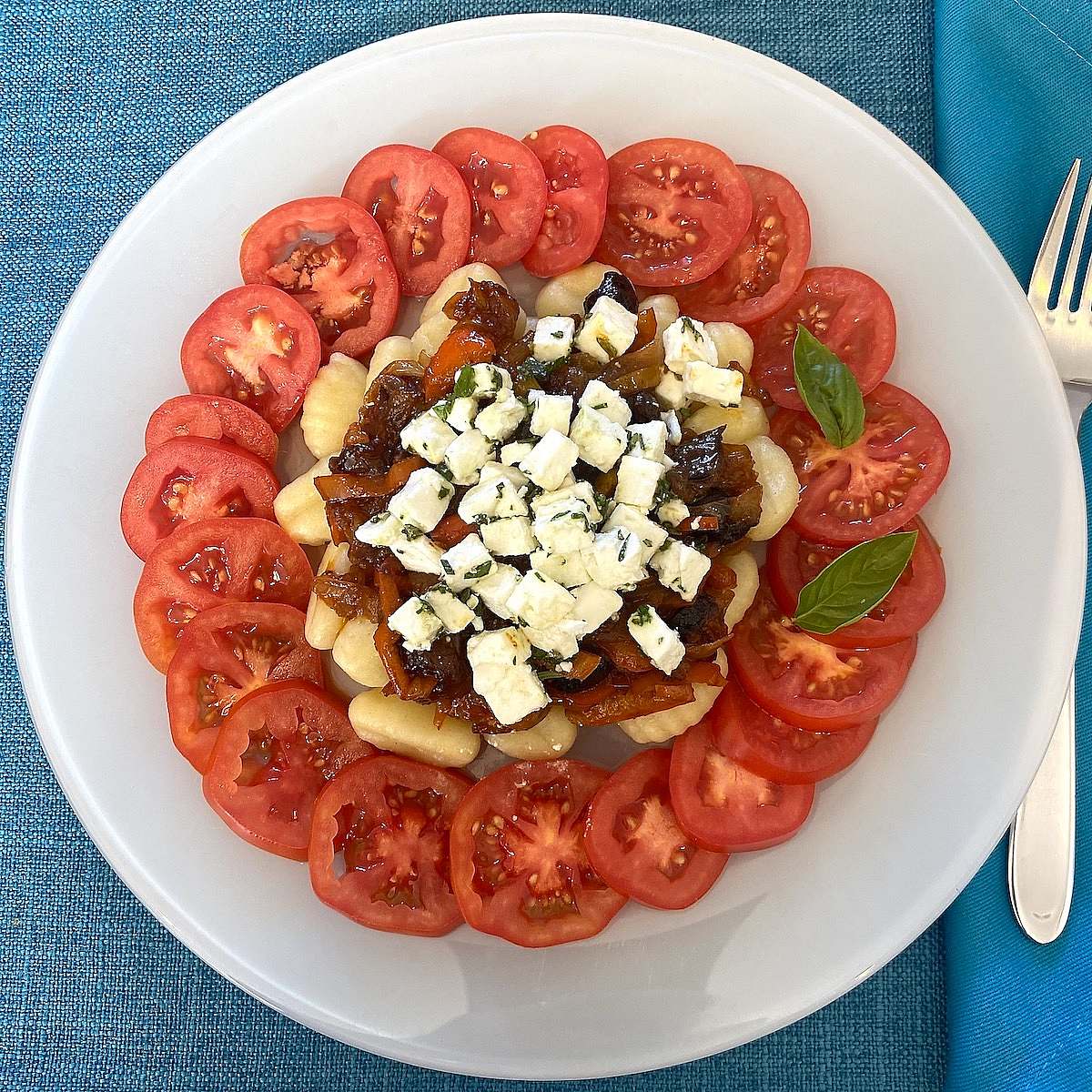 Serving of gnocchi and tomatoes