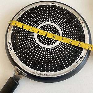 10-inch nonstick Tefal skillet measured with a tape — perfect for making evenly thin crêpes.